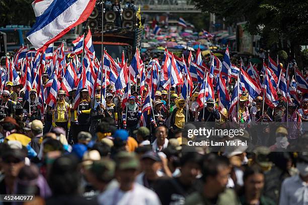 Anti-government protesters take part in a march at parliament on November 29, 2013 in Bangkok, Thailand. Anti-government protesters in Bangkok say...