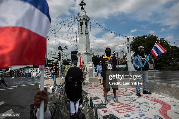 Anti-government protesters take part in a march at parliament on November 29, 2013 in Bangkok, Thailand. Anti-government protesters in Bangkok say...