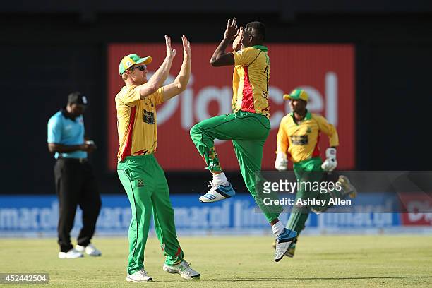 Ronsford Beaton and Jimmy Neesham celebrate during a match between Guyana Amazon Warriors and Jamaica Tallawahs as part of the week 2 of Caribbean...