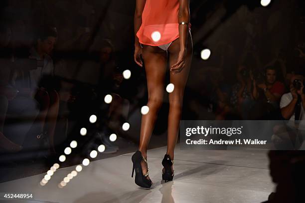 An alternative view of models on the runway at Mercedes-Benz Fashion Week Swim 2015 at The Raleigh on July 20, 2014 in Miami Beach, Florida.