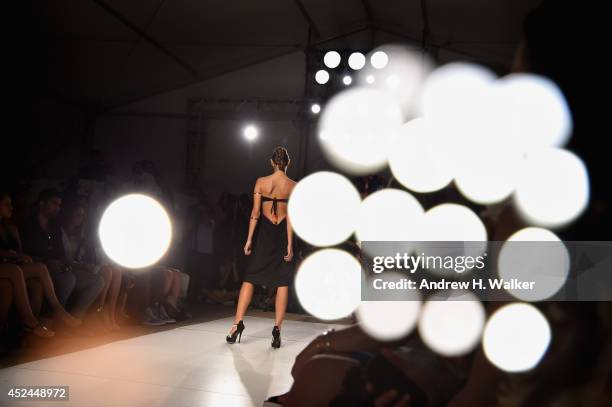 An alternative view of models on the runway at Mercedes-Benz Fashion Week Swim 2015 at The Raleigh on July 20, 2014 in Miami Beach, Florida.
