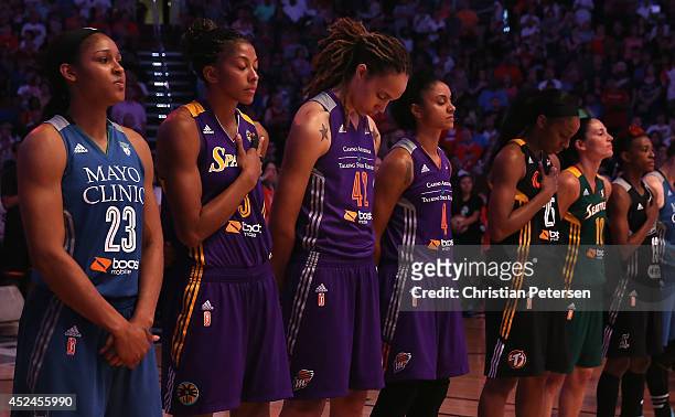 Western Conference All-Star Brittney Griner of the Phoenix Mercury stands attended with teammates for the National Anthem before the WNBA All-Star...