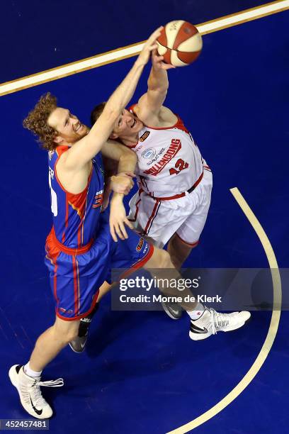 Luke Schenscher of the 36ers competes with Dave Gruber of the Hawks during the round eight NBL match between the Adelaide 36ers and the Wollongong...