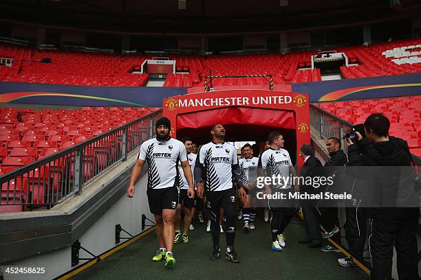 Sam Kasiano and Frank-Paul Nu'uausala walk out onto the pitch during the New Zealand training session at Old Trafford on November 29, 2013 in...