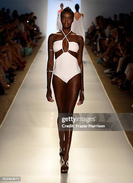 Model walks the runway during 6 Shore Road by Pooja fashion show during Mercedes-Benz Fashion Week Swim 2015 at Cabana Grande at The Raleigh on July...