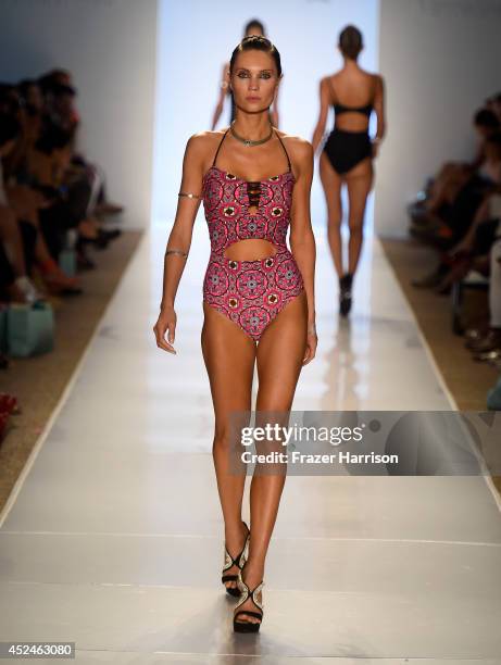 Model walks the runway during 6 Shore Road by Pooja fashion show during Mercedes-Benz Fashion Week Swim 2015 at Cabana Grande at The Raleigh on July...