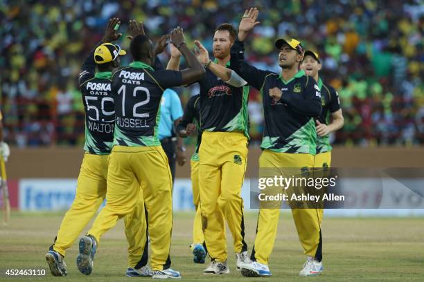 Rusty Theron and the Jamaican Tallawahs celebrate another wicket during a match between Guyana Amazon Warriors and Jamaica Tallawahs as part of the...