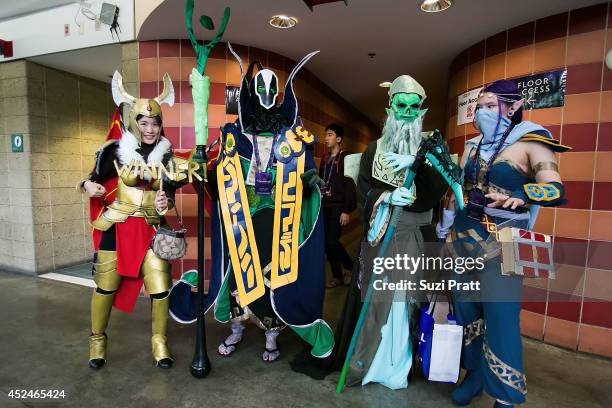 Fans dressed in cosplay pose for a photo at The International DOTA 2 Championships on July 20, 2014 in Seattle, Washington.