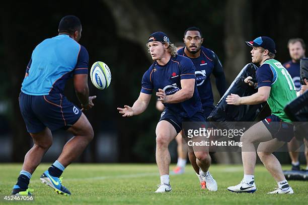 Michael Hooper of the Waratahs passes during a Waratahs Super Rugby training session at Moore Park on July 21, 2014 in Sydney, Australia.