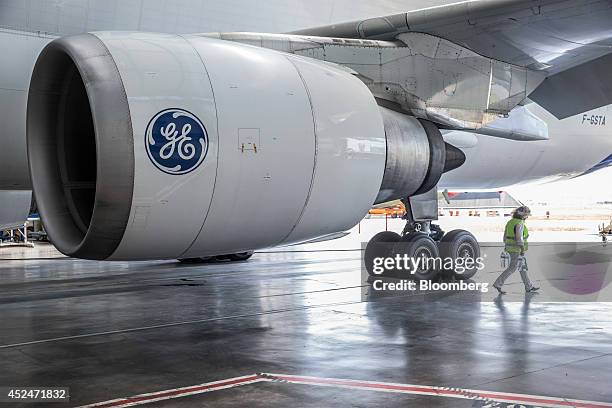 The General Electric Co. Logo sits on a GE Aviation CF6-80C jet engine as it hangs from the wing of an Airbus A300-600 Beluga super transporter...