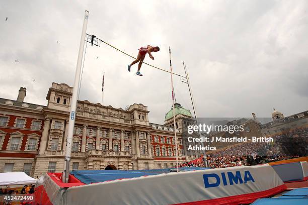 Karsten Dilla of Germany clears a height in the Mens pole vault during the Sainsbury's Anniversary Games at Horse Guards Parade on July 20, 2014 in...