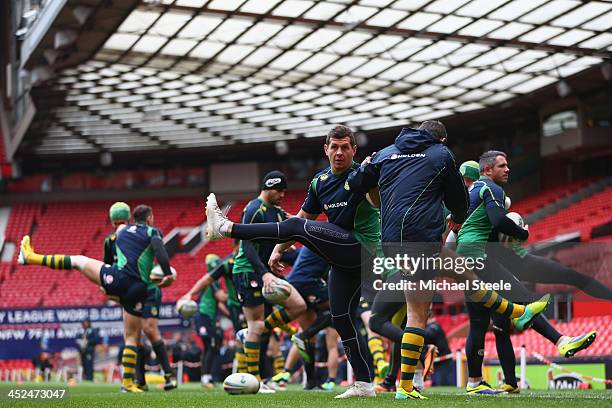 Greg Bird stretches alongside Cameron Smith during the Australia training session at Old Trafford on November 29, 2013 in Manchester, England.