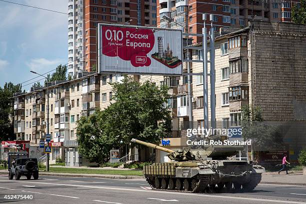 Tank operated by pro-Russia rebels is driven down Artena in the direction of the central railway station on July 21, 2014 in Donetsk, Ukraine. Local...