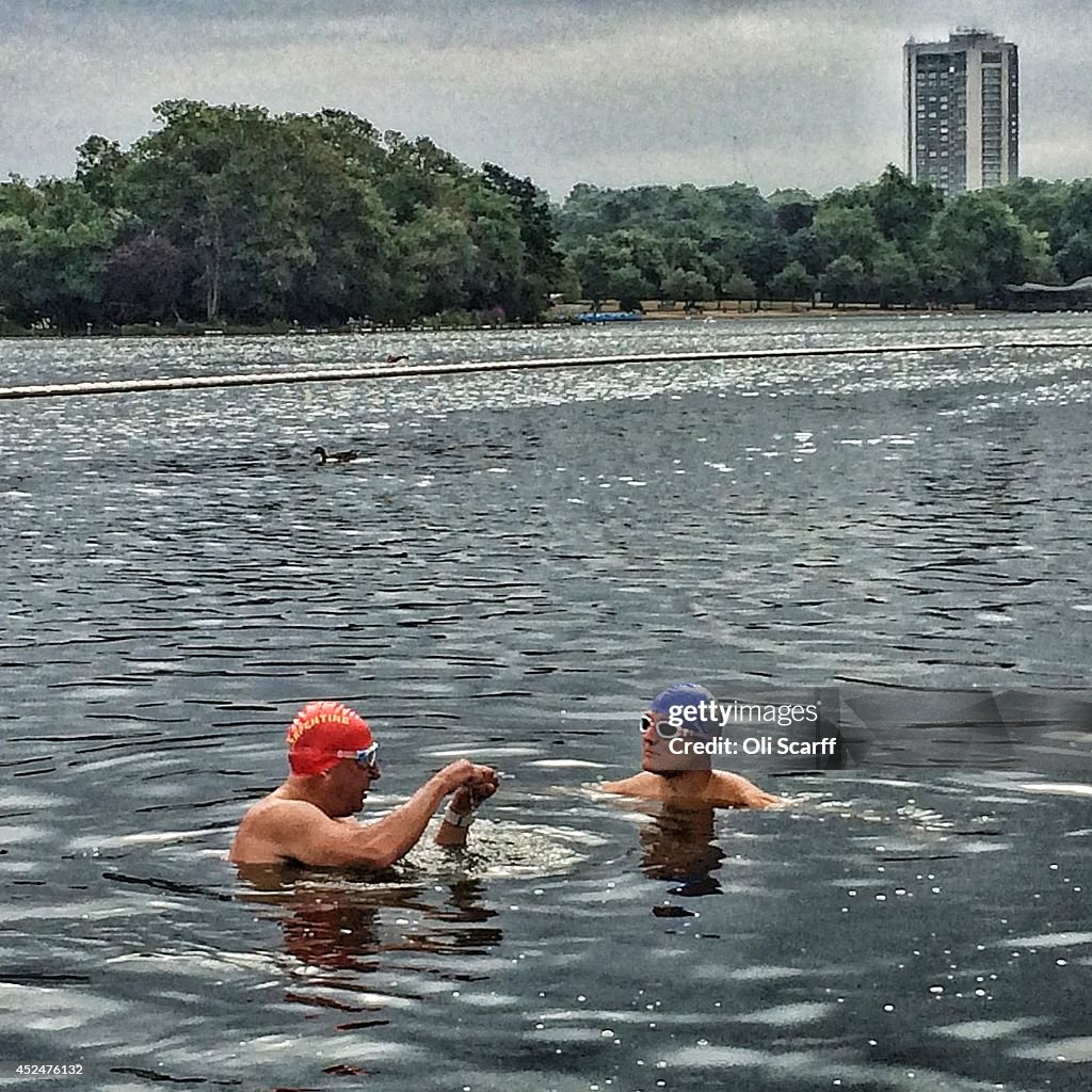 Swimmers Take An Early Dip In The Serpentine Lido