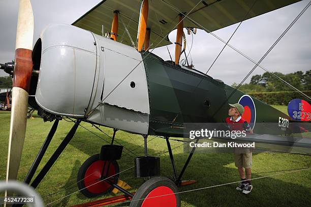 Aviation enthusiast Patrick Wilson 8, from Wetherby looks at an Avro 504 k at 'The Shuttlesworth Collection' at Old Warden on July 21, 2014 in...