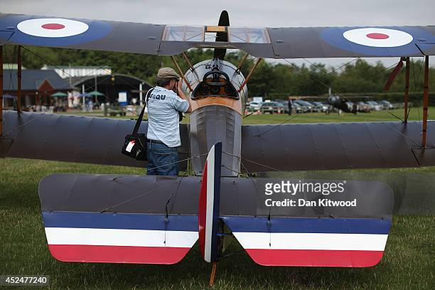 An aviation enthusiast takes a photograph of Sopwith Pup at 'The Shuttlesworth Collection' on July 21, 2014 in Biggleswade, England. Of the 55,000...