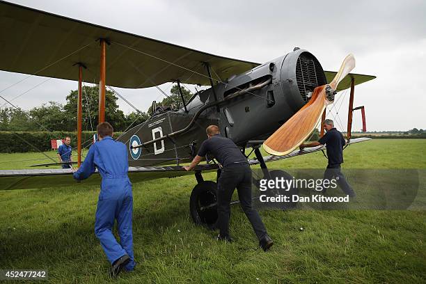Shuttleworth Collection engineers position a F2b fighter at 'The Shuttlesworth Collection' at Old Warden on July 21, 2014 in Biggleswade, England. Of...