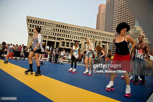 Hundreds of skaters doing their thing to Disco music during the Donna Summer Roller Disco Tribute at City Hall Plaza on Friday, July 18, 2014.