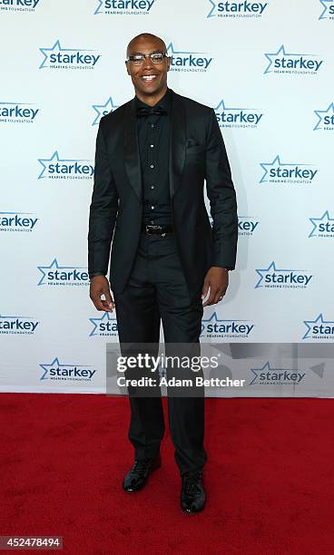 Caron Butler walks the red carpet at the 2014 Starkey Hearing Foundation So The World May Hear Gala at the St. Paul RiverCentre on July 20, 2014 in...