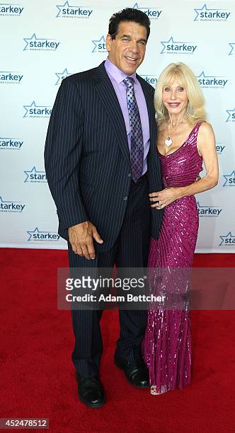 Lou Ferrigno and guest walk the red carpet at the 2014 Starkey Hearing Foundation So The World May Hear Gala at the St. Paul RiverCentre on July 20,...