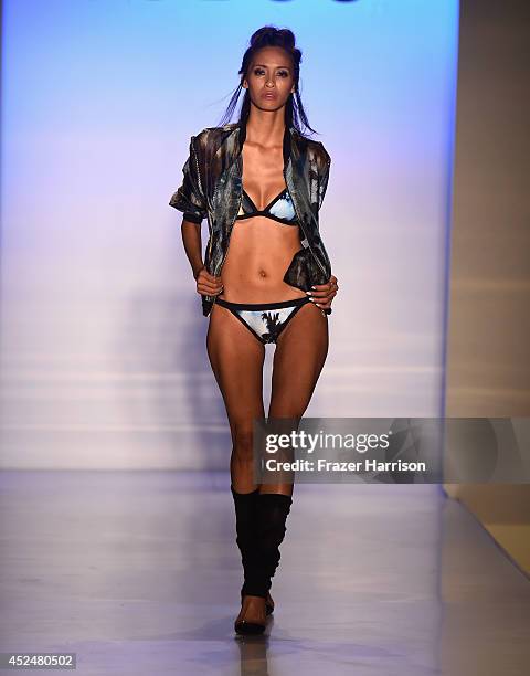 Model walks the runway during Suboo show at Mercedes-Benz Fashion Week Swim 2015 at The Raleigh on July 20, 2014 in Miami Beach, Florida.