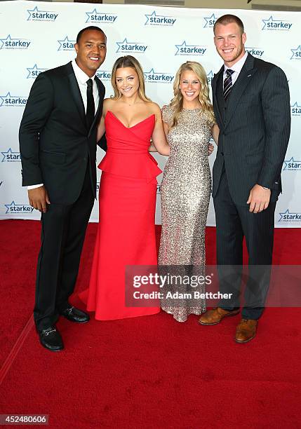 Michael Floyd, Kyle Rudolph and guests walk the red carpet at the 2014 Starkey Hearing Foundation So The World May Hear Gala at the St. Paul...