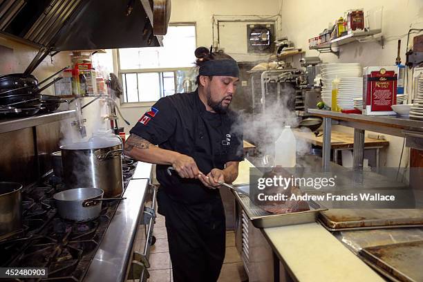 Lamesa Filipino Kitchen chef Rudy Boquila recreates his Filipina mother's Christmas ham. First of 3-part xmas series on non-turkey dinners. November...