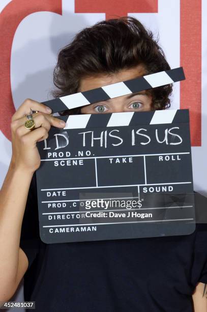 Harry Styles of One Direction attends a photocall for 'One Direction - This Is Us' at Big Sky Studios on August 19, 2013 in London, England.
