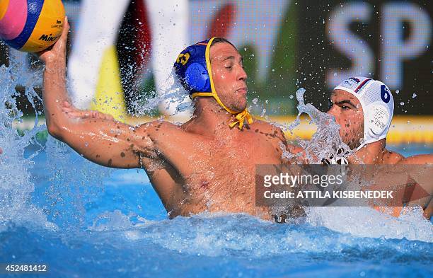 Spain's Albert Espanol vies with Serbian Dusko Pijetlovic during the men's Water Polo European Championships match Serbia vs Spain in Budapest on...