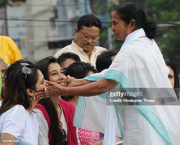 Party chief and West Bengal Chief Minister Mamata Banerjee with Tollywood stars during Shaheed Diwas rally organized by the TMC party at Esplanade on...