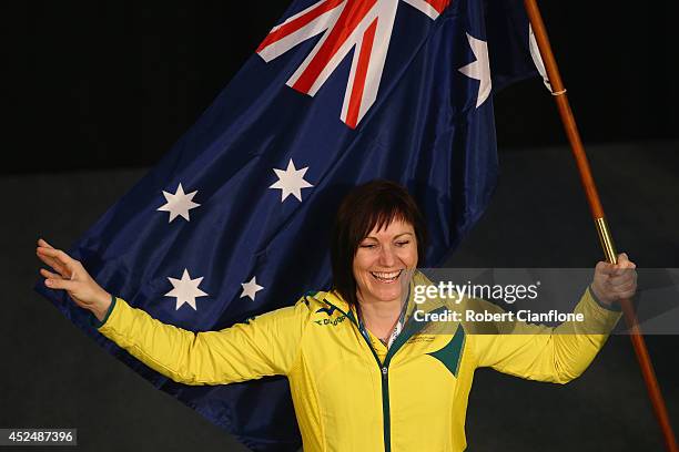 Anna Meares of Australia poses with the Australian flag after she was announced as the flag bearer for the opening ceremony, during the Austrlian...