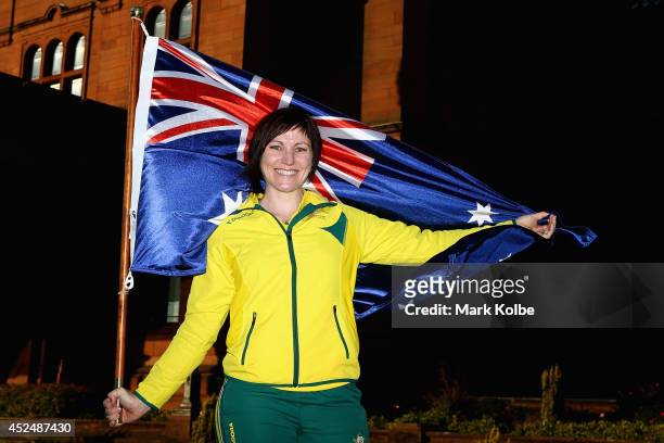Anna Meares of Australia poses with the Australian flag after she was announced as the flag bearer for the opening ceremony, during the Austrlian...