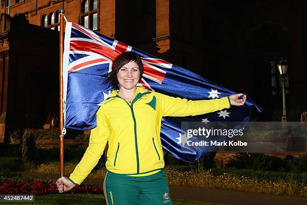 Anna Meares of Australia poses with the Australian flag after she was announced as the flag bearer for the opening ceremony, during the Austrlian...