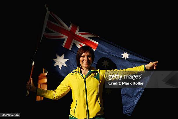 Anna Meares of Australia poses with the Australian flag after she was announced as the flag bearer for the opening ceremony, during the Austrlian...