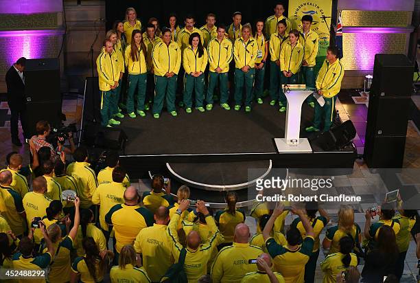 Australian athletes sing the national anthem during the Australian Commonwealth Games official team reception at the Kelvin Grove Art Gallery and...