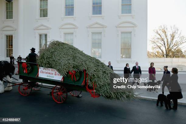 First lady Michelle Obama and her dog Sunny; her daughters Sasha Obama and Malia Obama and the family dog Bo; Christopher Botek and Kyra Yurko of...