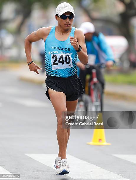 Cristian Chocho of Ecuador leads in 50k walk race as part of the XVII Bolivarian Games Trujillo 2013 at Juan Pablo Street on November 29, 2013 in...