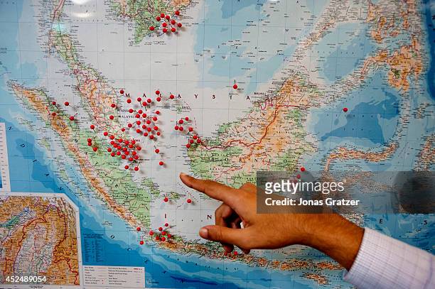Noel Choong points to a map inside the IMB's Piracy Reporting Centre to show where pirate attacks have been occurring in recent years. The red pins...