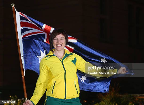 Anna Meares of Australia poses with the Australian flag after she was announced as the flag bearer for the opening ceremony, during the Austrlian...