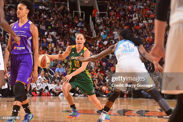 Sue Bird of the Western Conference All-Star dribbles against Jessica Breland of the Eastern Conference All-Stars during the 2014 Boost Mobile WNBA...