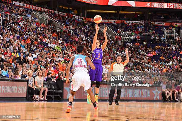 Diana Taurasi of the Western Conference All-Stars shoots against Angel McCoughtry of the Eastern Conference All-Stars during the 2014 Boost Mobile...