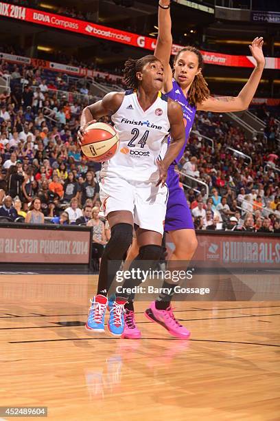 Tamika Catchings of the Eastern Conference All-Stars dribbles against Brittney Griner of the Western Conference All-Stars during the 2014 Boost...
