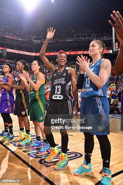 Danielle Robinson of the Western Conference All-Stars waves during the 2014 Boost Mobile WNBA All-Star Game on July 19, 2014 at US Airways Center in...