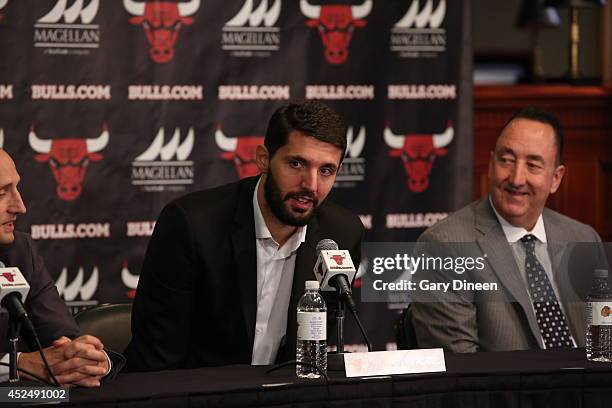 Chicago Bulls head coach Tom Thibodeau and general manager Gar Forman introduce newly-signed free agent Nikola Mirotic, accompanied by guest...