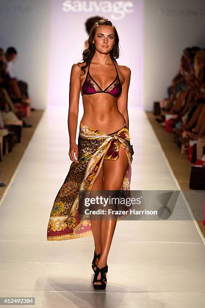 Model walks the runway at the Sauvage/Aguaclara Swimwear/Aquarella Swimwear/Mia Marcelle/Toxic Sadie Swimwear fashion show during Mercedes-Benz...