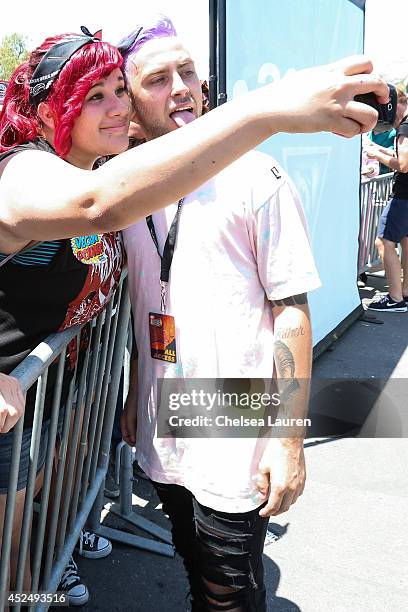 Vocalist Tyler Carter of ISSUES greets fans during the Vans Warped Tour on June 25, 2014 in Chula Vista, California.