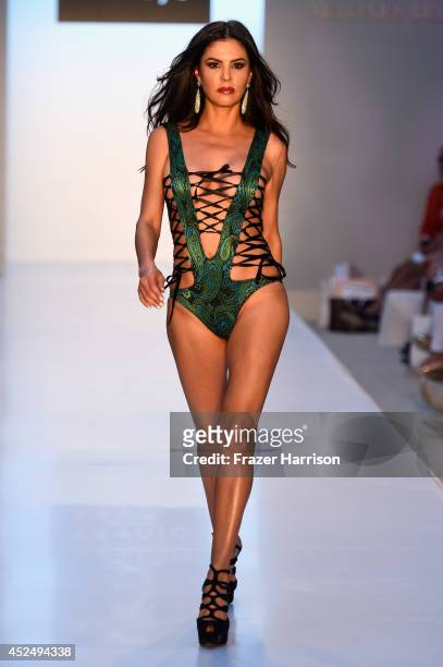 Personality Adriana De Moura walks the runway at the A.Z Araujo show during Mercedes-Benz Fashion Week Swim 2015 at The Raleigh on July 21, 2014 in...