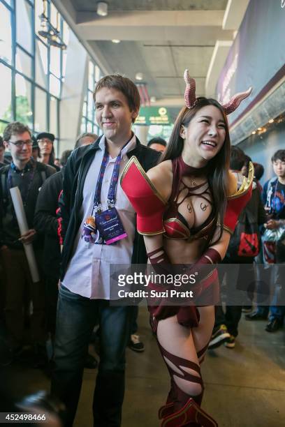 Dominik "Black ^" Reitmeier poses with a fan at The International DOTA 2 Championships at Key Arena on July 21, 2014 in Seattle, Washington.