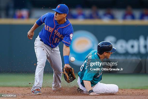 Willie Bloomquist of the Seattle Mariners steals second base against shortstop Ruben Tejada of the New York Mets in the first inning at Safeco Field...