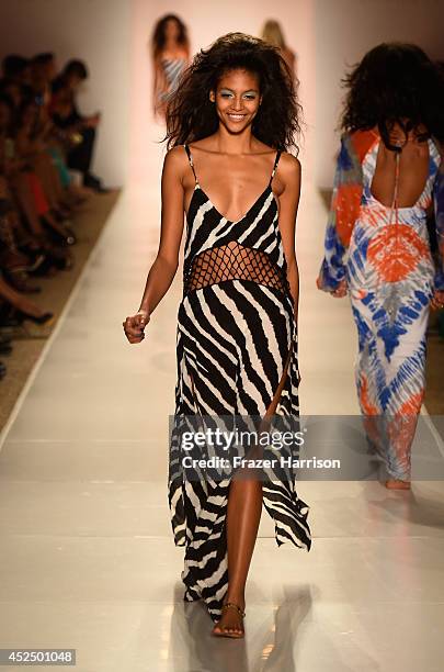 Model walks the runway during Indah show at Mercedes-Benz Fashion Week Swim 2015 at Cabana Grande at the Raleigh on July 21, 2014 in Miami, Florida.